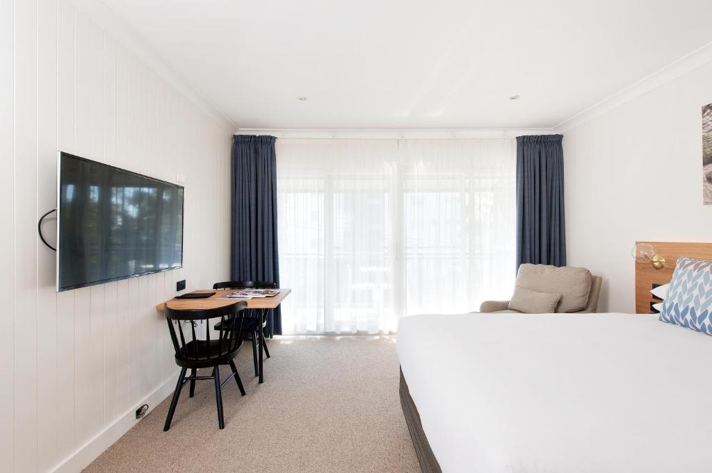 TV a/nebo společenská místnost v ubytování Hotel Nelson