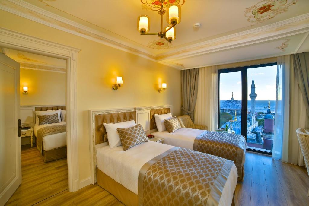A bed or beds in a room at Yılsam Sultanahmet Hotel
