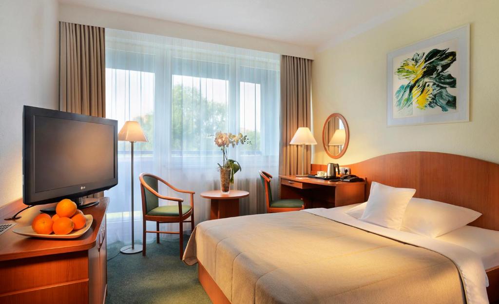 Postel nebo postele na pokoji v ubytování Clarion Congress Hotel Ostrava