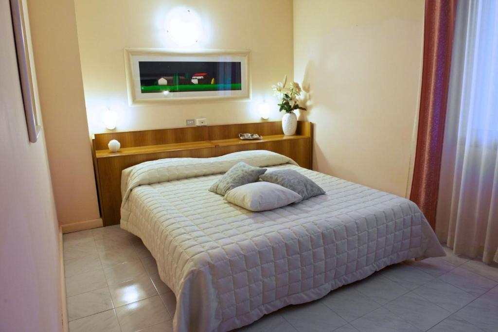 Postel nebo postele na pokoji v ubytování Hotel Europa