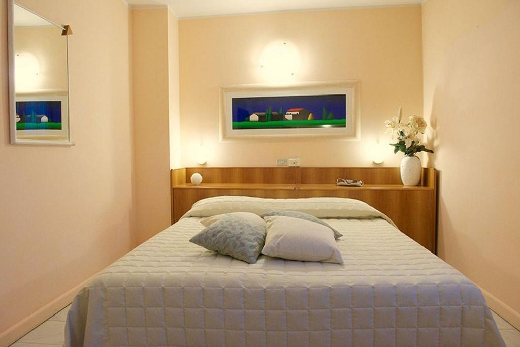 Postel nebo postele na pokoji v ubytování Hotel Europa