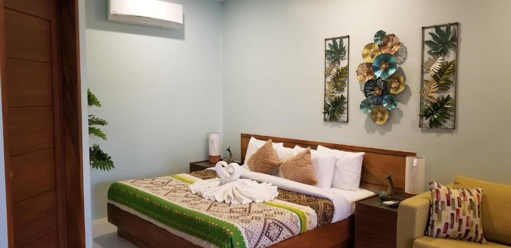 Postel nebo postele na pokoji v ubytování Tropical Fun Ta Sea Rentals