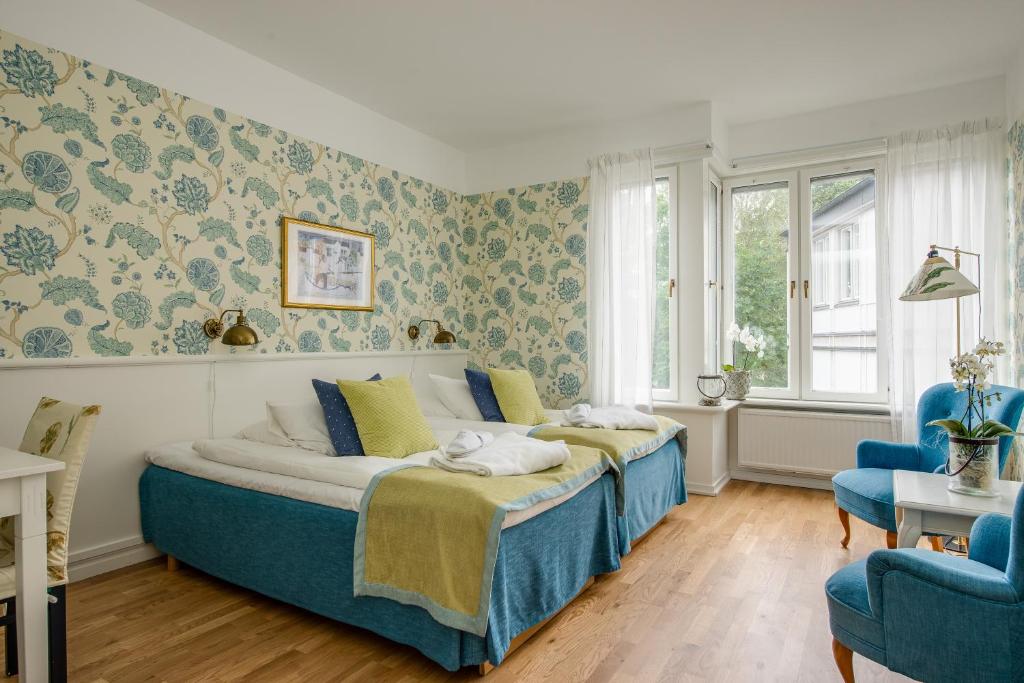Postel nebo postele na pokoji v ubytování Trosa Stadshotell & Spa