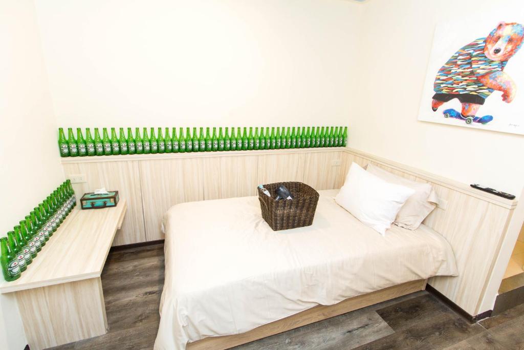 Postel nebo postele na pokoji v ubytování Meizhou Hot Spring Hotel溫泉商旅