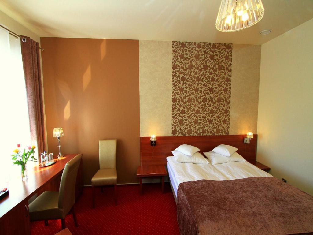 Posteľ alebo postele v izbe v ubytovaní Hotel Rydzewski