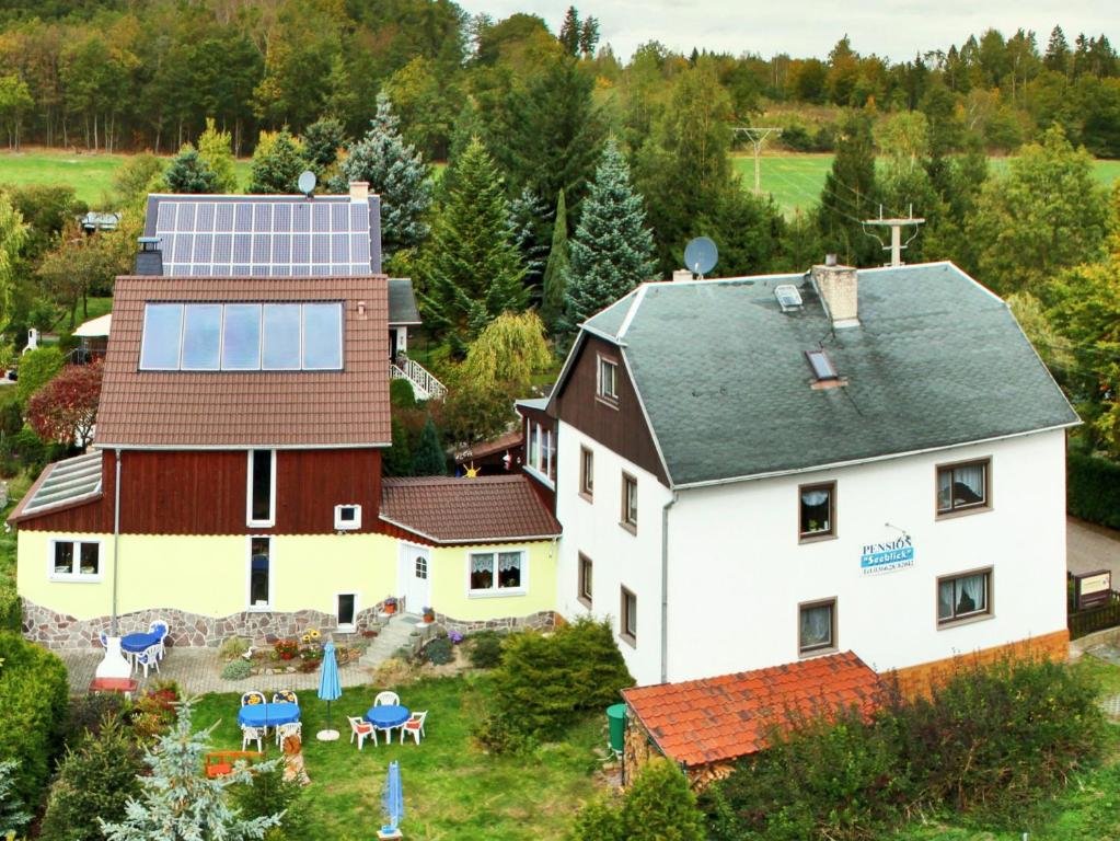 an aerial view of a house with a solar roof at Pension Seeblick in Quingenberg