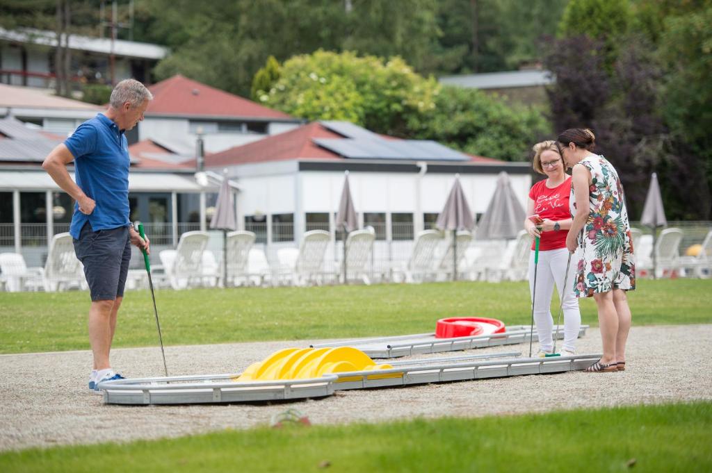 a group of people standing next to an amphibious raft at Domaine Long Pre in Stavelot