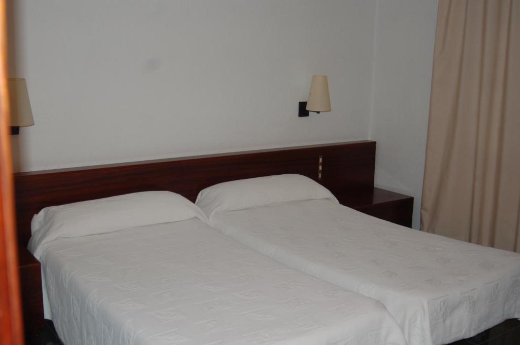 Postel nebo postele na pokoji v ubytování Hotel Betriu