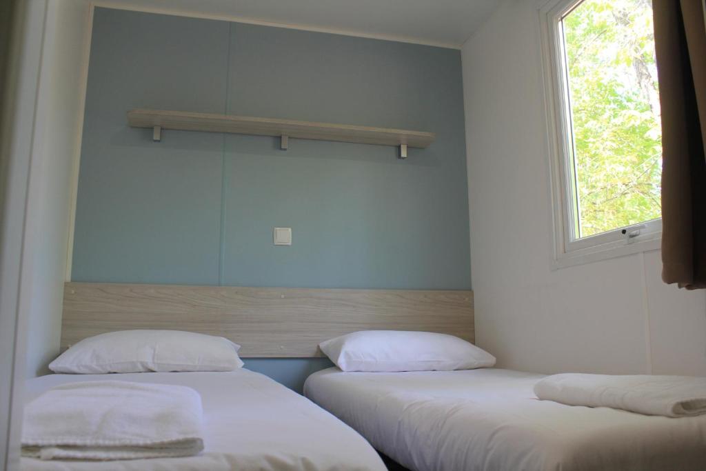 Postel nebo postele na pokoji v ubytování Camping La Fundicion