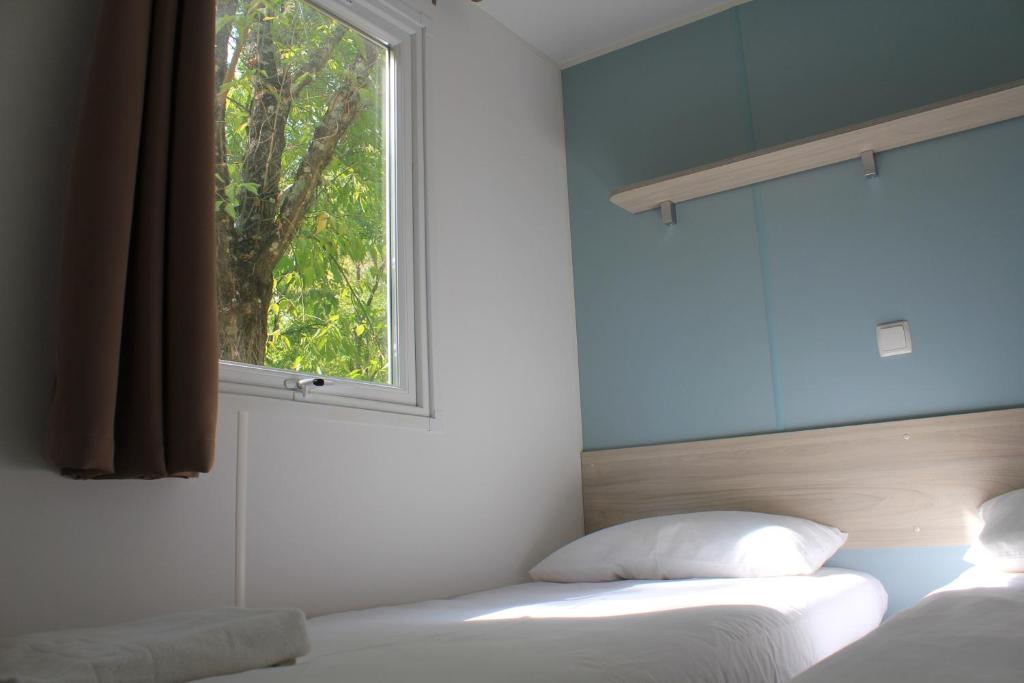 Postel nebo postele na pokoji v ubytování Camping La Fundicion