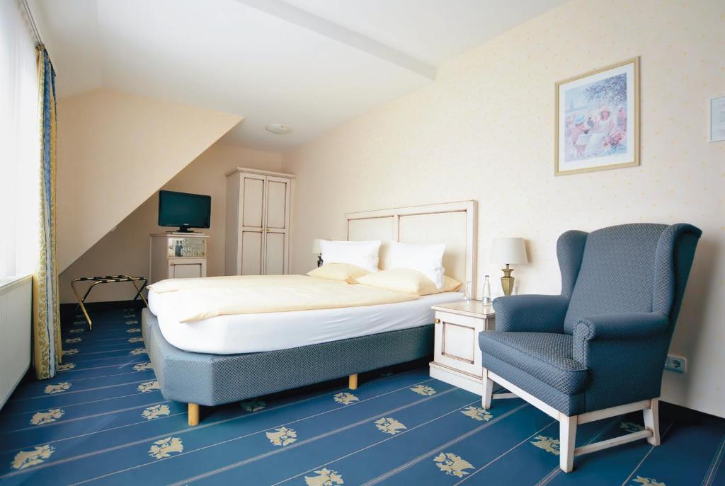 Postel nebo postele na pokoji v ubytování Hotel Jugendstil