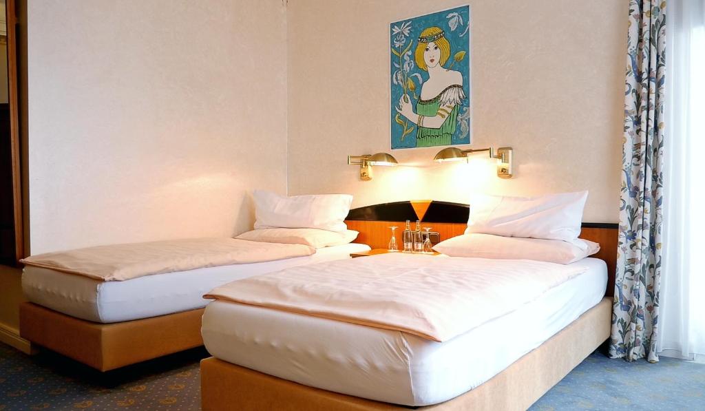 Postel nebo postele na pokoji v ubytování Hotel Jugendstil