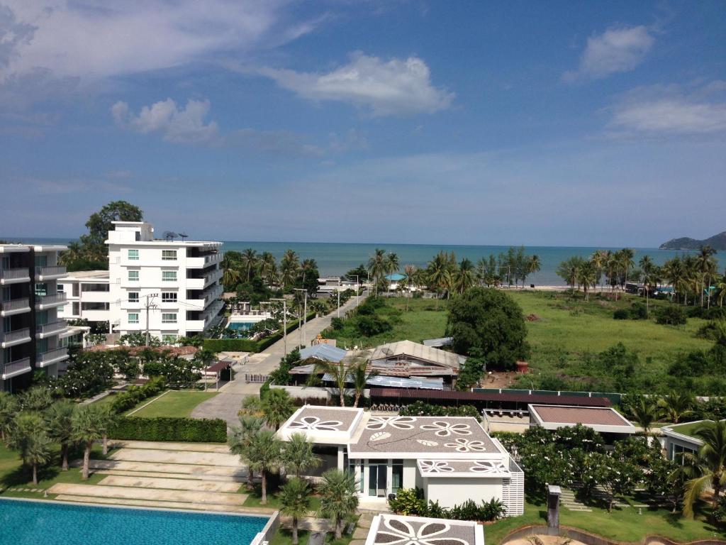 an aerial view of a resort with a swimming pool at The Sea Condominium in Ban Nong Khaem