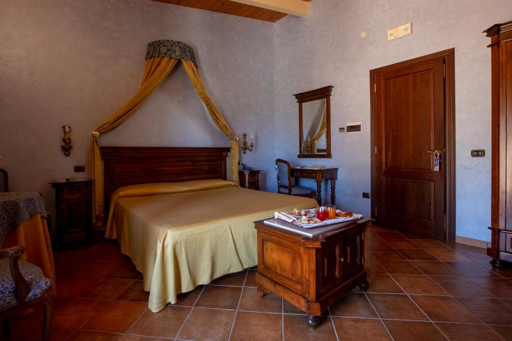 Postel nebo postele na pokoji v ubytování Hotel Il Podere