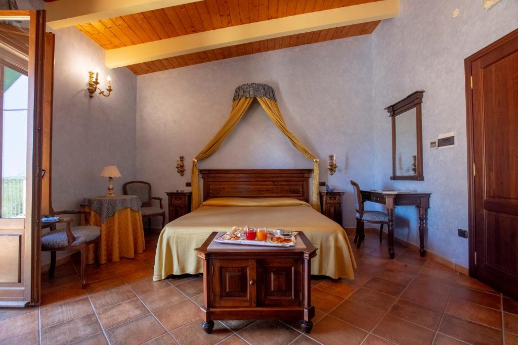 Postel nebo postele na pokoji v ubytování Hotel Il Podere