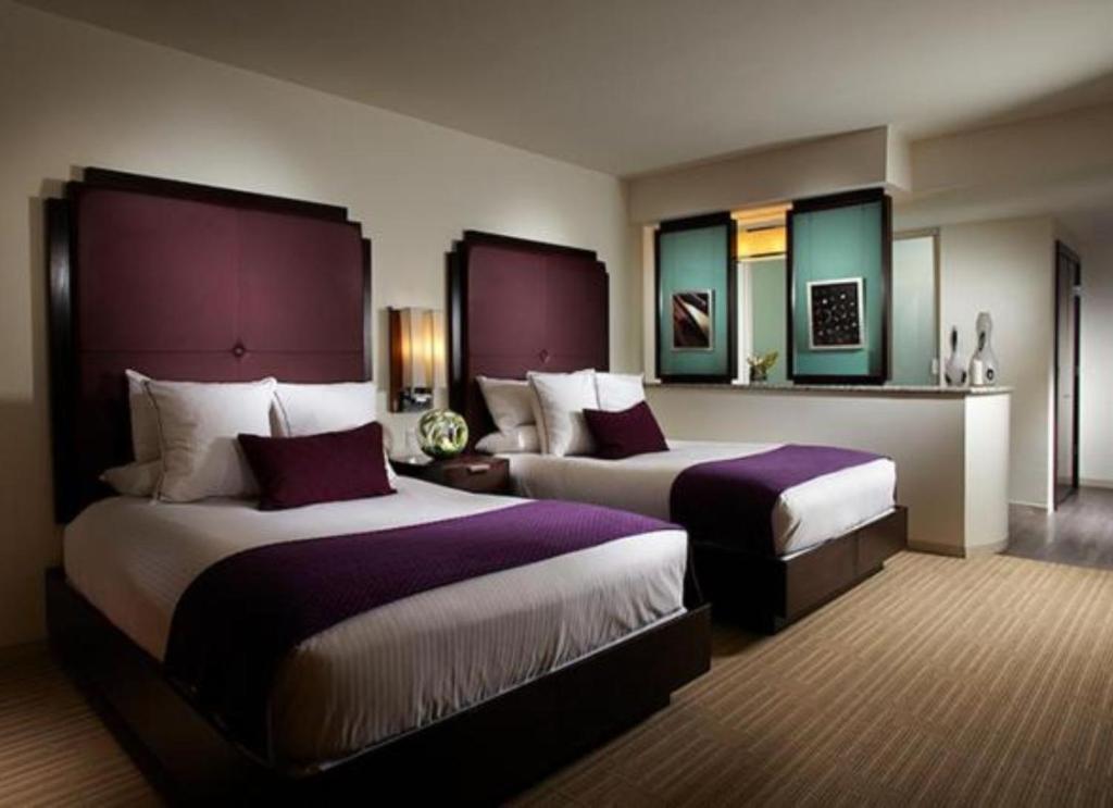 Ein Bett oder Betten in einem Zimmer der Unterkunft Hard Rock Hotel &amp; Casino Biloxi