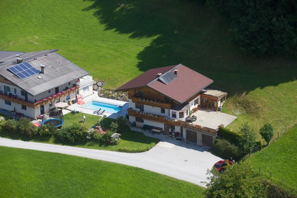 an aerial view of a house with a swimming pool at Appartementhaus Eisbauer in Sankt Johann im Pongau