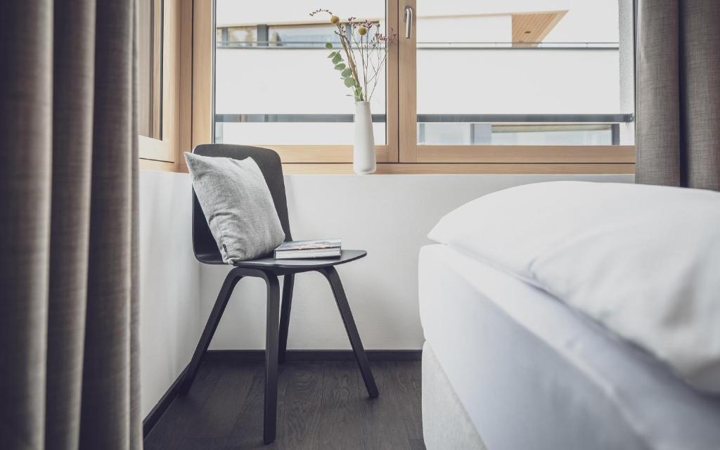 Postel nebo postele na pokoji v ubytování Parsenn Resort