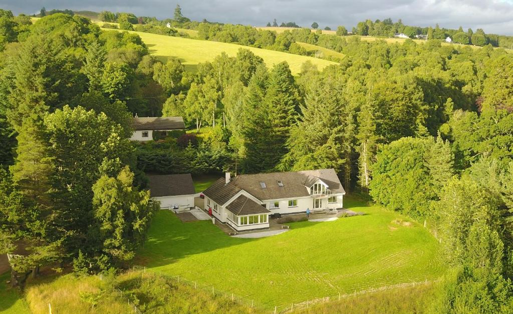 an aerial view of a house on a green lawn at High March in Drumnadrochit
