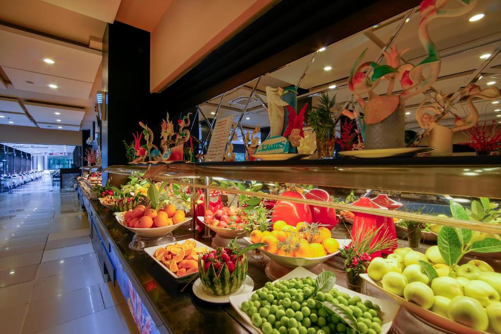 a display of fruits and vegetables in a grocery store at Limak Atlantis Deluxe Hotel Belek in Belek