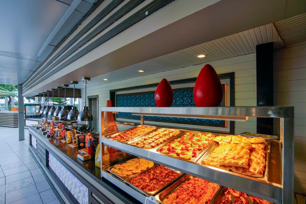 a buffet line with many different types of food at Limak Atlantis Deluxe Hotel Belek in Belek