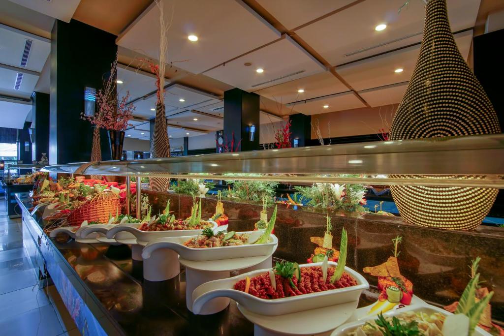 a display of vegetables in sinks in a store at Limak Atlantis Deluxe Hotel Belek in Belek