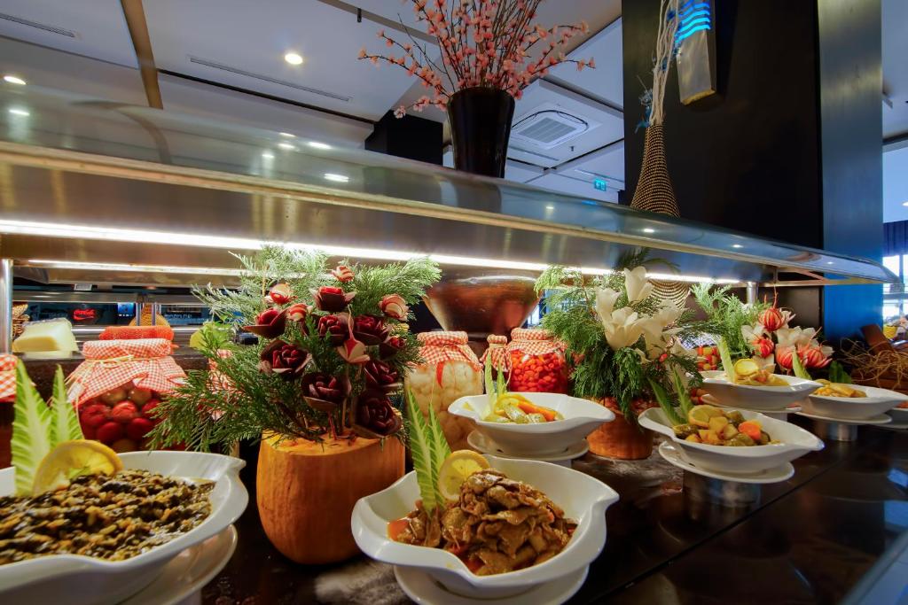 a buffet line with many different types of food at Limak Atlantis Deluxe Hotel Belek in Belek