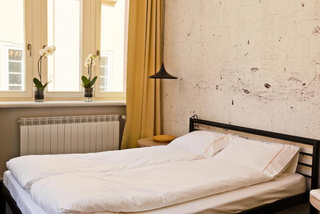 Posteľ alebo postele v izbe v ubytovaní Sleep in Hostel & Apartments Stary Rynek