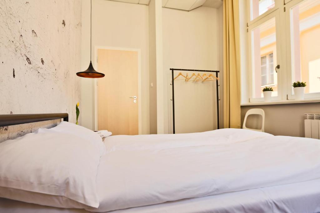 Posteľ alebo postele v izbe v ubytovaní Sleep in Hostel & Apartments Stary Rynek