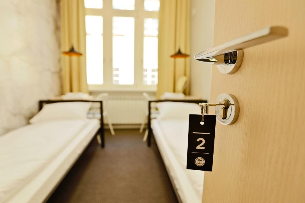 Posteľ alebo postele v izbe v ubytovaní Sleep in Hostel & Apartments Stary Rynek