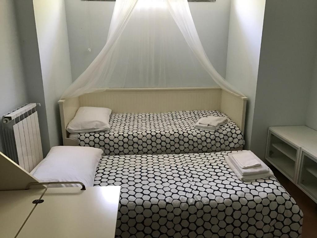 Postel nebo postele na pokoji v ubytování Buellis House