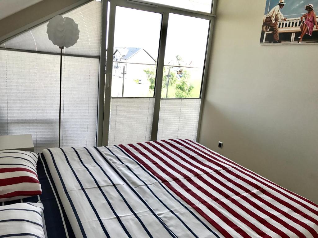 Posteľ alebo postele v izbe v ubytovaní Willa Dobryłko II -Apartamenty