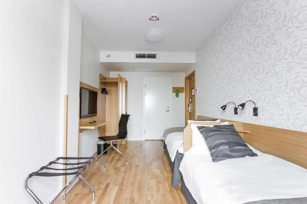 Postel nebo postele na pokoji v ubytování Hotel Spekeröd