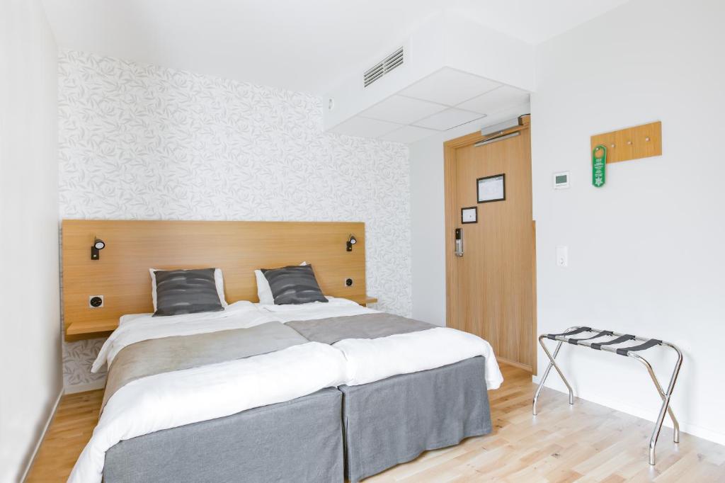 Postel nebo postele na pokoji v ubytování Hotel Spekeröd