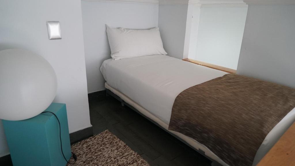 Postel nebo postele na pokoji v ubytování Natalino Hotel Patagonia