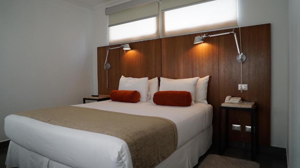 Postel nebo postele na pokoji v ubytování Natalino Hotel Patagonia