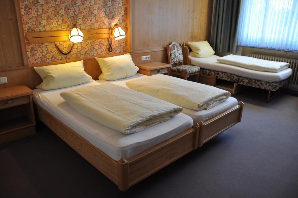 Postel nebo postele na pokoji v ubytování Hotel Bürgerhof