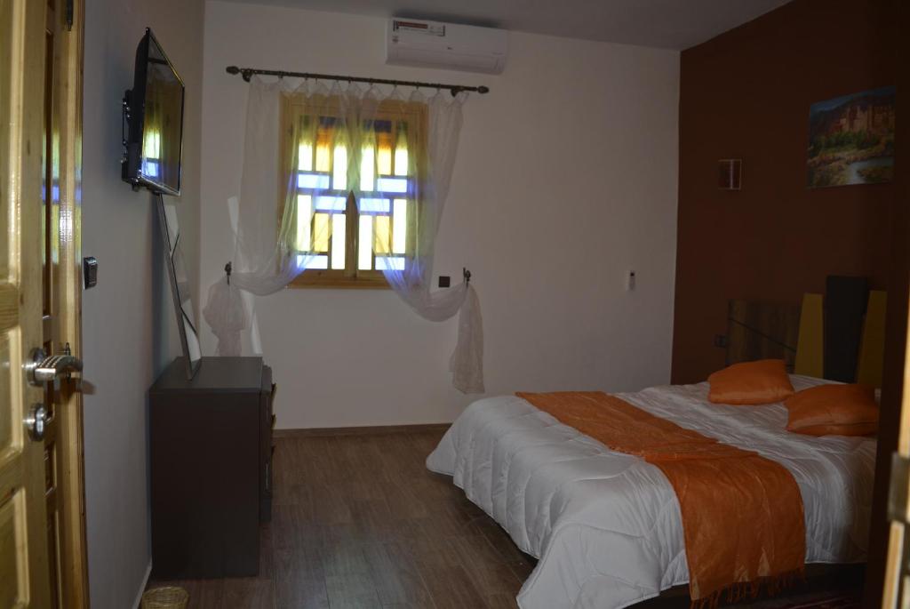 Postel nebo postele na pokoji v ubytování Maison d'hôtes Tinwitchi