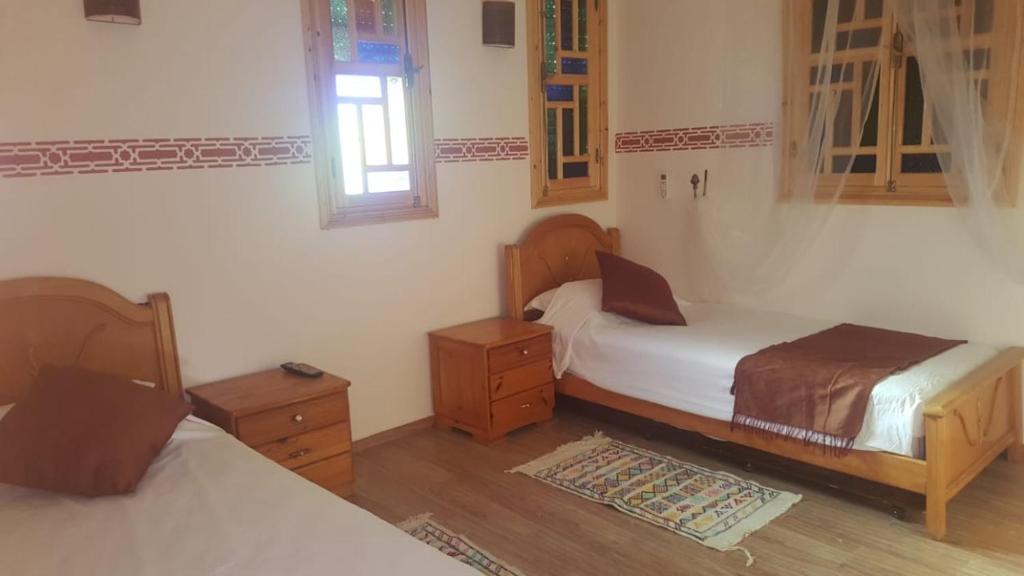 Postel nebo postele na pokoji v ubytování Maison d'hôtes Tinwitchi
