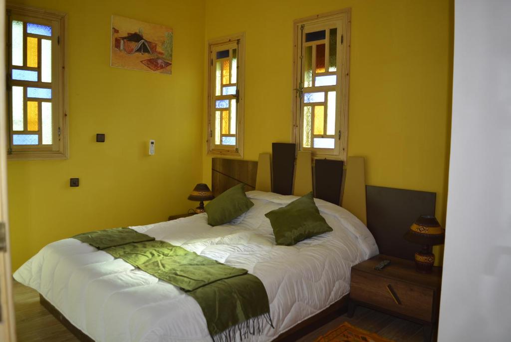Postel nebo postele na pokoji v ubytování Maison d'hôtes Tinwitchi