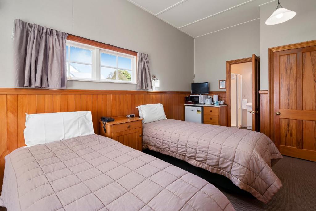 Postel nebo postele na pokoji v ubytování Huka Falls Resort