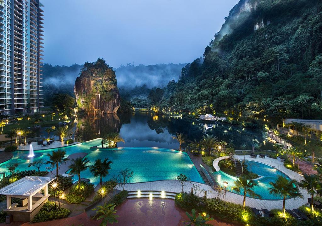 a view of a resort with a lake and mountains at The Haven All Suite Resort, Ipoh in Ipoh