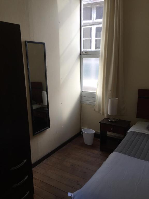 Postel nebo postele na pokoji v ubytování Hostal Rama & CaStle