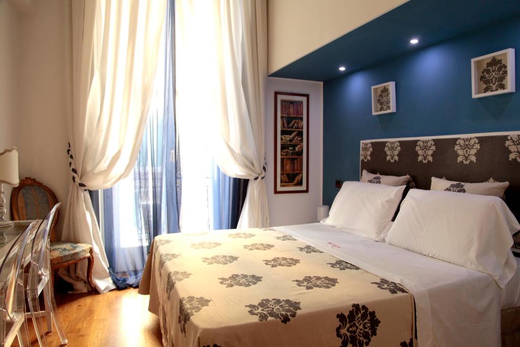Posteľ alebo postele v izbe v ubytovaní B&B Orsini 46
