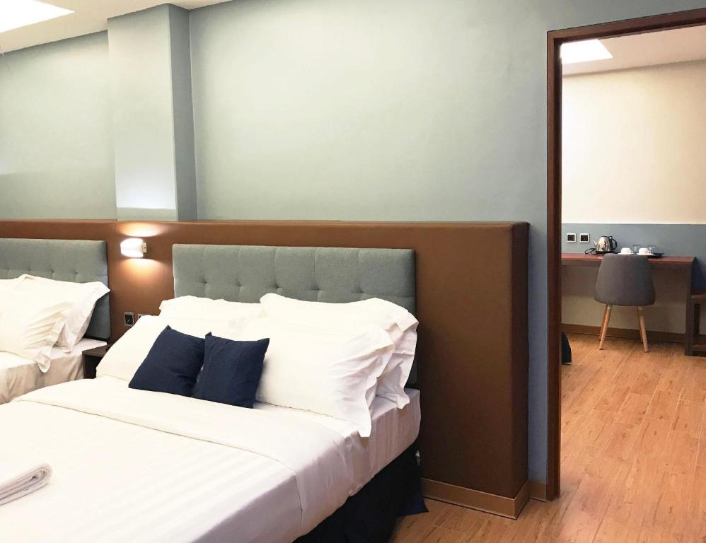 Postel nebo postele na pokoji v ubytování Henia Hotel