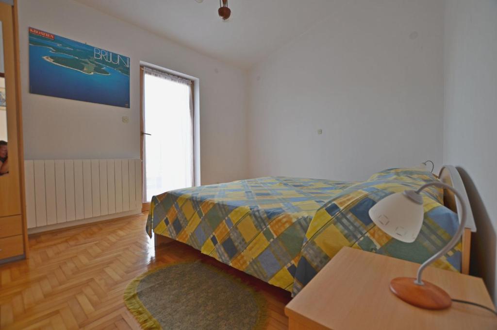 Postel nebo postele na pokoji v ubytování Apartments Josip