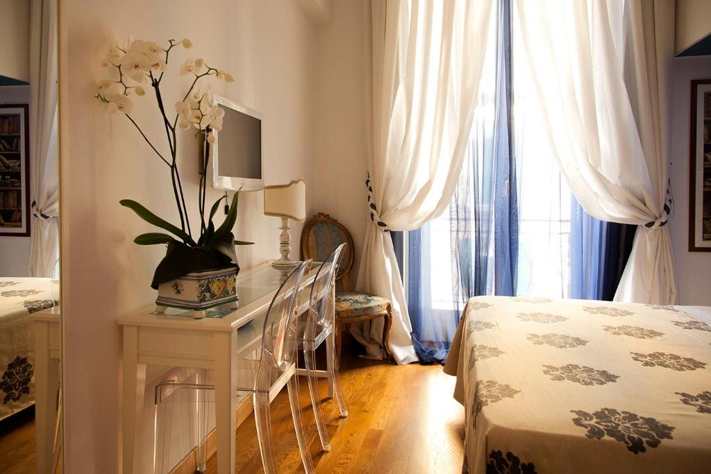 Posteľ alebo postele v izbe v ubytovaní B&B Orsini 46