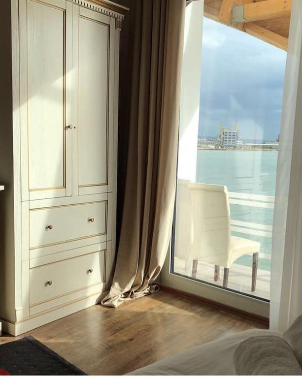 Postel nebo postele na pokoji v ubytování Ventus Harbor Hotel