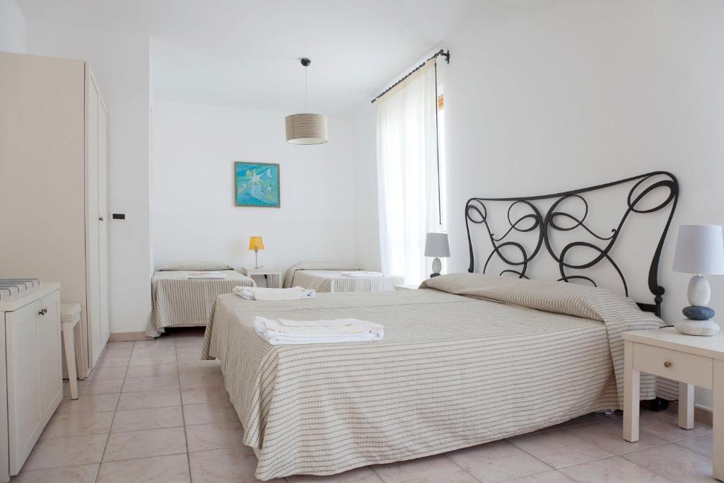 Postel nebo postele na pokoji v ubytování Hotel Amarea - Aeolian Charme