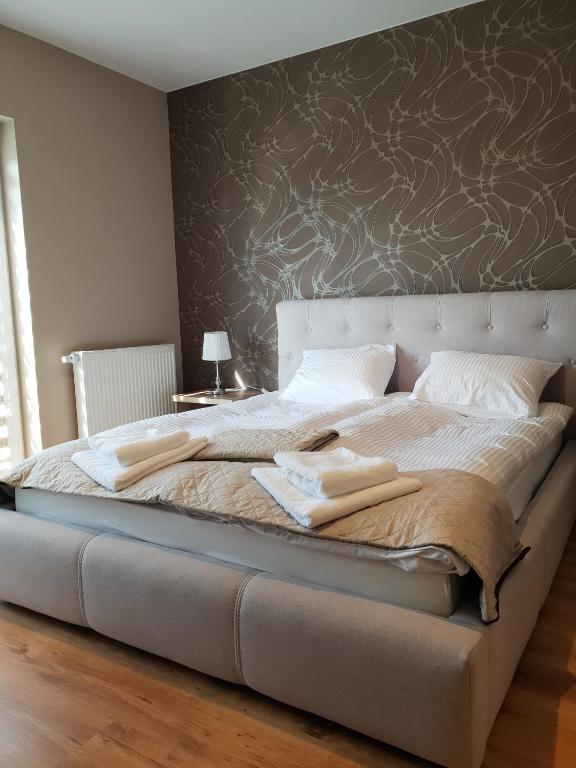 Postel nebo postele na pokoji v ubytování Hotel Pod Strzechą